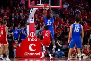 Creighton Bluejay center Fredrick King (33) dunks the ball against Nebraska Cornhusker forward Matar Diop (21) in the second half during the men’s college basketball game on Sunday, December 3, 2023, in Lincoln, Neb. Photo by John S. Peterson.
