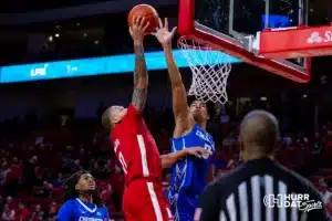Nebraska Cornhusker guard C.J. Wilcher (0) tries for a lay up against Creighton Bluejay forward Jasen Green (0) during the men’s college basketball game on Sunday, December 3, 2023, in Lincoln, Neb. Photo by John S. Peterson.