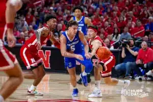 Nebraska Cornhusker guard Keisei Tominaga (30) knocks the ball away from Creighton Bluejay guard Francisco Farabello (5) in the first half during the men’s college basketball game on Sunday, December 3, 2023, in Lincoln, Neb. Photo by John S. Peterson.