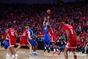 Creighton Bluejay guard Baylor Scheierman (55) makes a three point shot against Nebraska Cornhusker forward Juwan Gary (4) in the first half during the men’s college basketball game on Sunday, December 3, 2023, in Lincoln, Neb. Photo by John S. Peterson.