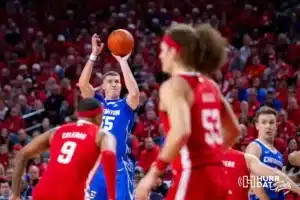 Creighton Bluejay guard Baylor Scheierman (55) makes a three point shot against Nebraska Cornhusker guard Jarron Coleman (9) in the first half during the men’s college basketball game on Sunday, December 3, 2023, in Lincoln, Neb. Photo by John S. Peterson.