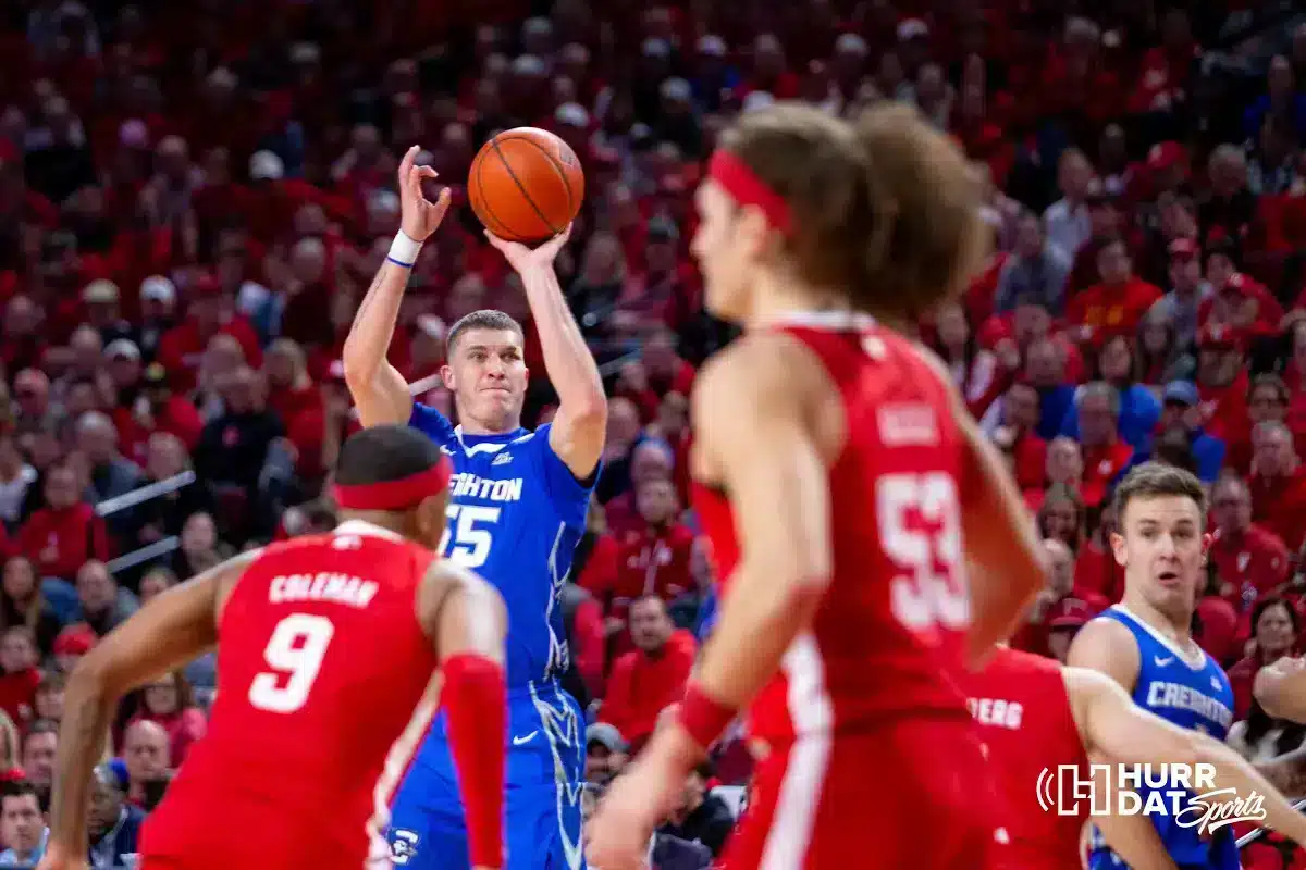Creighton Bluejay guard Baylor Scheierman (55) makes a three point shot against Nebraska Cornhusker guard Jarron Coleman (9) in the first half during the men’s college basketball game on Sunday, December 3, 2023, in Lincoln, Neb. Photo by John S. Peterson.
