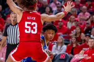 Creighton Bluejay guard Trey Alexander (23) dribbles the ball against Nebraska Cornhusker forward Josiah Allick (53) in the first half during the men’s college basketball game on Sunday, December 3, 2023, in Lincoln, Neb. Photo by John S. Peterson.