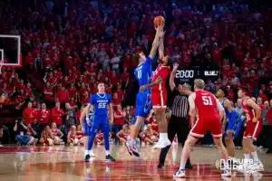 Creighton Bluejay center Ryan Kalkbrenner (11) and Nebraska Cornhusker guard Brice Williams (3) jump ball for the opening tip during the men’s college basketball game on Sunday, December 3, 2023, in Lincoln, Neb. Photo by John S. Peterson.