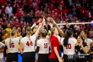 Nebraska Cornhuskers celebrate the win over the Missouri Tigers in three sets during the second round of the NCAA volleyball championships on Saturday, December 2, 2023, in Lincoln, Neb. Photo by John S. Peterson.