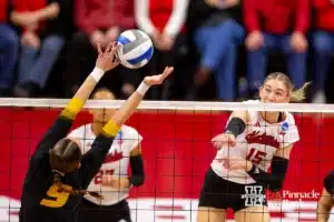 Nebraska Cornhusker Andi Jackson (15) spikes the ball against Missouri Tiger Morgan Isenberg (9) in the second set during the second round of the NCAA volleyball championships on Saturday, December 2, 2023, in Lincoln, Neb. Photo by John S. Peterson.