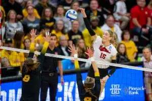 Nebraska Cornhusker Andi Jackson (15) spikes the ball against Missouri Tiger Dilara Gedikoglu (8) and Morgan Isenberg (9) in the second set during the second round of the NCAA volleyball championships on Saturday, December 2, 2023, in Lincoln, Neb. Photo by John S. Peterson.