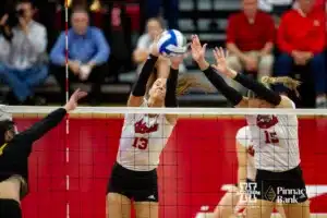 Nebraska Cornhusker Merritt Beason (13) and Andi Jackson (15) block a spike from the Missouri Tigers in the first set during the second round of the NCAA volleyball championships on Saturday, December 2, 2023, in Lincoln, Neb. Photo by John S. Peterson.