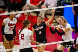 Nebraska Cornhusker Ally Batenhorst (14) give Bergen Reilly ten for setting the ball for her against the Missouri Tigers in the first set during the second round of the NCAA volleyball championships on Saturday, December 2, 2023, in Lincoln, Neb. Photo by John S. Peterson.