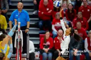 Nebraska Cornhusker Harper Murray (27) tips the ball over the Long Island Sharks in the third set during the first round of the NCAA volleyball championships on Friday, December 1, 2023, in Lincoln, Neb. Photo by John S. Peterson.