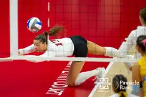 Nebraska Cornhusker Merritt Beason (13) dives for the ball against Long Island Sharks in the first set during the first round of the NCAA volleyball championships on Friday, December 1, 2023, in Lincoln, Neb. Photo by John S. Peterson.