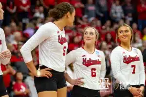 Nebraska Cornhusker Bekka Allick (5) and Nebraska Cornhusker Laney Choboy (6) share a moment before the introductions during the first round of the NCAA volleyball championships against the Long Island Sharks on Friday, December 1, 2023, in Lincoln, Neb. Photo by John S. Peterson.
