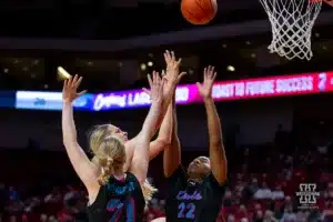 Nebraska Cornhusker forward Natalie Potts (22) puts up a shot against Florida Atlantic Owl forward Maria Myklebust (21) and center Dyllan Hanna (22) in the second half during the basketball game on Wednesday, November 29, 2023, in Lincoln, Neb. Photo by John S. Peterson.