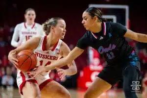 Nebraska Cornhusker guard Callin Hake (14) dribbles the ball against Florida Atlantic Owl guard Mya Perry (11) in the second half during the basketball game on Wednesday, November 29, 2023, in Lincoln, Neb. Photo by John S. Peterson.
