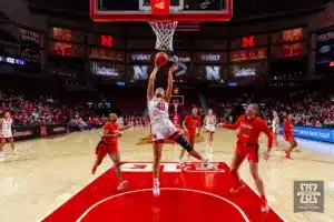 Nebraska Cornhusker center Alexis Markowski (40) makes a lay up against Illinois Fighting Illini forward Kendall Bostic (44) in the first hald during a college basketball game on Thursday, January 11, 2024, in Lincoln, Nebraska. Photo by John S. Peterson.