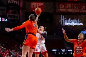 Nebraska Cornhusker guard Darian White (0) takes a shot against Illinois Fighting Illini forward Kendall Bostic (44) in the first half during a college basketball game on Thursday, January 11, 2024, in Lincoln, Nebraska. Photo by John S. Peterson.