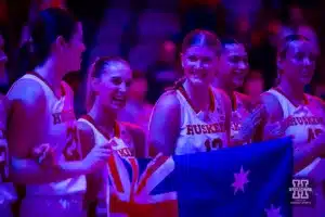 Australian Cornhuskers Jaz Shelley (1) and Jessica Petrie (12) hold the Australian flag while the Australiain National Anthem was played before taking on the Illinois Fighting Illini during a college basketball game on Thursday, January 11, 2024, in Lincoln, Nebraska. Photo by John S. Peterson.