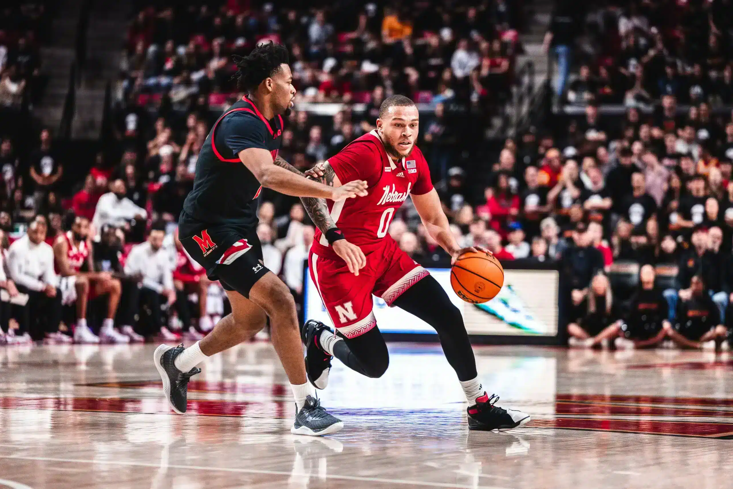 CHAR8758 Nebraska guard C.J. Wilcher drives to the basket at Maryland.