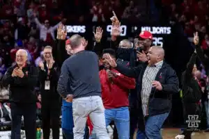 Former Nebraska basketball play Eric Piatkowski celebrates making a half court shot during a college basketball game on Saturday, January 20, 2024, in Lincoln, Nebraska. Photo by John S. Peterson.