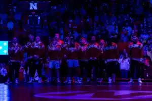 Nebraska Cornhuskers standing for the National Anthem before taking the Iowa Hawkeyes during a college wrestling march on Friday, January 12, 2024, in Lincoln, Nebraska. Photo by John S. Peterson.