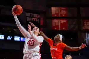 Nebraska Cornhusker guard Maddie Krull (42) makes a lay up against Illinois Fighting Illini guard Genesis Bryant (1) in the first half during a college basketball game on Thursday, January 11, 2024, in Lincoln, Nebraska. Photo by John S. Peterson.