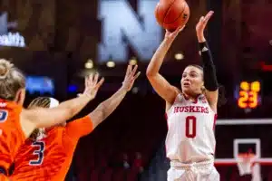 Nebraska Cornhusker guard Darian White (0) puts up a shot against Illinois Fighting Illini guard Makira Cook (3) in the first half during a college basketball game on Thursday, January 11, 2024, in Lincoln, Nebraska. Photo by John S. Peterson.