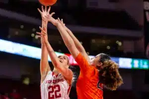 Nebraska Cornhusker forward Natalie Potts (22) makes a lay up against Illinois Fighting Illini forward Brynn Shoup-Hill (23) in the first half during a college basketball game on Thursday, January 11, 2024, in Lincoln, Nebraska. Photo by John S. Peterson.