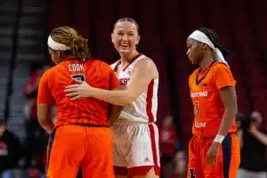 Nebraska Cornhusker guard Callin Hake (14) gives Illinois Fighting Illini guard Makira Cook (3) a hug at the end of the game during a college basketball game on Thursday, January 11, 2024, in Lincoln, Nebraska. Photo by John S. Peterson.