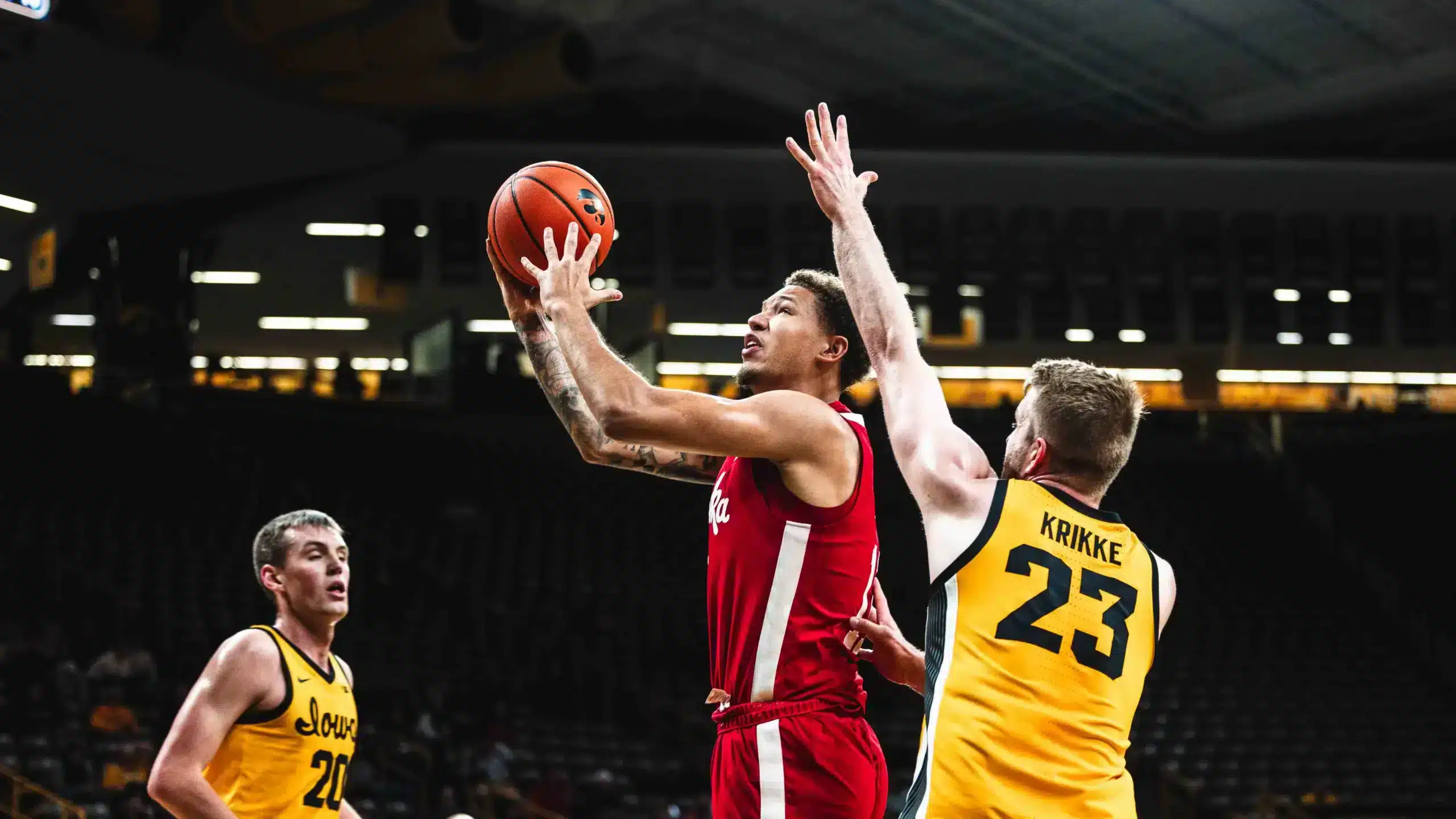 Nebraska at Iowa Nebraska freshman Eli Rice scores at the basket against a pair of Hawkeyes.