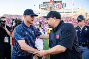 Nebraska Cornhuskers head coach Matt Rhule and Michigan Wolverines head coach Jim Harbaugh shake hands after a college football game in Lincoln, Nebraska, Saturday, September 30, 2023. Photo by John Peterson.