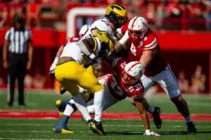 Nebraska Cornhuskers Javin Wright (33) tackles Michigan Wolverines running back Donovan Edwards (7) during a college football game in Lincoln, Nebraska, Saturday, September 30, 2023. Photo by John Peterson.