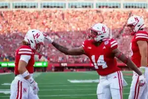 Nebraska Cornhuskers Rahmir Johnson (14) rubs Billy Kemp's helmet  celebrating his first quarter touchdown against the NIU Huskies during a college football game in Lincoln, Nebraska, Friday, September 15, 2023. Photo by John Peterson.