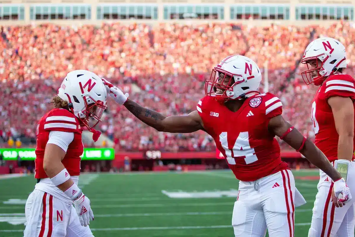 Nebraska Cornhuskers Rahmir Johnson (14) rubs Billy Kemp's helmet  celebrating his first quarter touchdown against the NIU Huskies during a college football game in Lincoln, Nebraska, Friday, September 15, 2023. Photo by John Peterson.