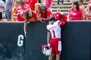 wide receiver Billy Kemp IV (1) of the Nebraska Cornhuskers gets a hug after the game against the Colorado Buffaloes during a college football game in Boulder, Colorado, Friday, September 9, 2023. Photo by John Peterson.