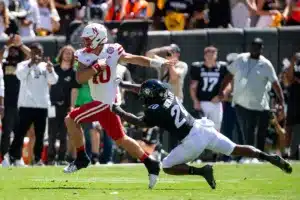Heinrich Haarberg (10) quarterback of the Nebraska Cornhuskers runs with the ball against linebacker LaVonta Bentley (20) of the Colorado Buffaloes in the fourth quarter during a college football game in Boulder, Colorado, Friday, September 9, 2023. Photo by John Peterson.