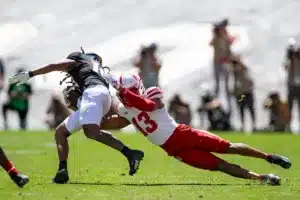 Malcolm Hartzog (13) of the Nebraska Cornhuskers tackles Xavier Weaver (10) of the Colorado Buffaloes in the fourth quarter during a college football game in Boulder, Colorado, Friday, September 9, 2023. Photo by John Peterson.