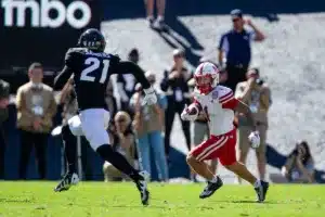 Billy Kemp IV (1) of the Nebraska Cornhuskers runs with the ball against Shilo Sanders (21) of the Colorado Buffaloes in the first quarter during a college football game in Boulder, Colorado, Friday, September 9, 2023. Photo by John Peterson.