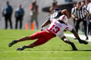 Malcolm Hartzog (13) Nebraska Cornhuskers defensive back tackles Xavier Weaver (10) Colorado Buffaloes wide receiver in the first quarter during a college football game in Boulder, Colorado, Friday, September 9, 2023. Photo by John Peterson.