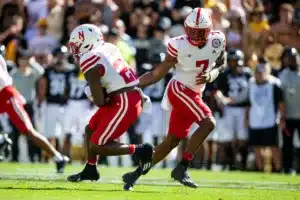 Jeff Sims (7) quarterback of the Nebraska Cornhuskers hands the ball off to Gabe Ervin Jr. (22) running back of the Nebraska Cornhuskers in the first quarter against the Colorado Buffaloes during a college football game in Boulder, Colorado, Friday, September 9, 2023. Photo by John Peterson.