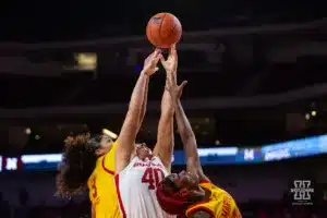 Nebraska Cornhusker center Alexis Markowski (40) reaches for the rebound against Maryland Terrapin guard Lavender Briggs (3) and guard Bri McDaniel (24) in the second half during a college basketball game on Sunday, December 31, 2023, in Lincoln, Nebraska. Photo by John S. Peterson.