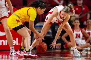 Nebraska Cornhusker forward Natalie Potts (22) reaches for a loose ball against the Maryland Terrapins in the second half during a college basketball game on Sunday, December 31, 2023, in Lincoln, Nebraska. Photo by John S. Peterson.