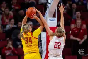 Nebraska Cornhusker forward Natalie Potts (22) tries to block Maryland Terrapin guard Emily Fisher (34) in the second half during a college basketball game on Sunday, December 31, 2023, in Lincoln, Nebraska. Photo by John S. Peterson.