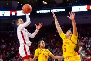 Nebraska Cornhusker guard Darian White (0) makes a jump shot against Maryland Terrapin guard Brinae Alexander (5) in the second half during a college basketball game on Sunday, December 31, 2023, in Lincoln, Nebraska. Photo by John S. Peterson.