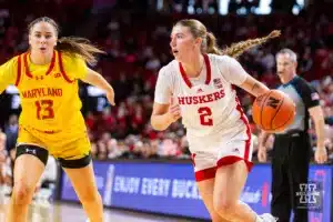Nebraska Cornhusker guard Logan Nissley (2) drives to the basket against Maryland Terrapin guard Faith Masonius (13) in the first half during a college basketball game on Sunday, December 31, 2023, in Lincoln, Nebraska. Photo by John S. Peterson.