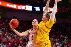 Nebraska Cornhusker guard Jaz Shelley (1) makes a layup agianst Maryland Terrapin forward Allie Kubek (14) in the first half during a college basketball game on Sunday, December 31, 2023, in Lincoln, Nebraska. Photo by John S. Peterson.