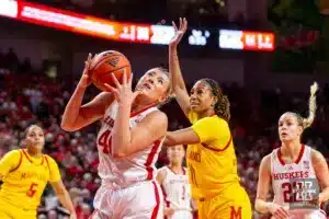 Nebraska Cornhusker center Alexis Markowski (40) grabs the rebound against Maryland Terrapin guard Jakia Brown-Turner (11) in the first half during a college basketball game on Sunday, December 31, 2023, in Lincoln, Nebraska. Photo by John S. Peterson.