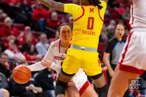 Nebraska Cornhusker guard Maddie Krull (42) passes the ball against Maryland Terrapin guard Shyanne Sellers (0) in the first quarter during a college basketball game on Sunday, December 31, 2023, in Lincoln, Nebraska. Photo by John S. Peterson.