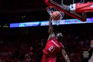 Nebraska Cornhusker football player Emmett Johnson (21) performs in the halftime dunk contest during a college basketball game against the Minnesota Golden Gophers Sunday, February 25, 2024, in Lincoln, Neb. Photo by John S. Peterson.
