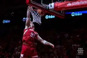Nebraska Cornhuskers football player Kai Wallin (93) performs in the halftime dunk contest during a college basketball game against the Minnesota Golden Gophers Sunday, February 25, 2024, in Lincoln, Neb. Photo by John S. Peterson.