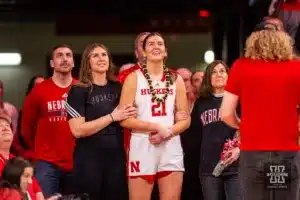 Nebraska Cornhusker senior Annika Stewart watches a video to be recognized after the win over Minnesota Golden Gophers during a college basketball game Saturday, February 24, 2024, in Lincoln, Neb. Photo by John S. Peterson.